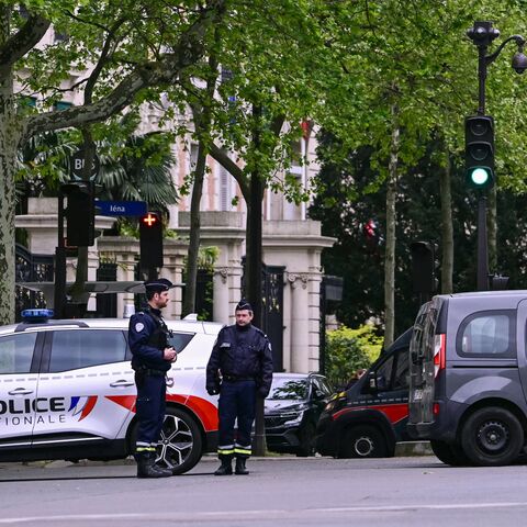 French police officers take part in a security perimeter near the Iranian Consulate in Paris after a person was suspected of entering the building with explosives, April 19, 2024.